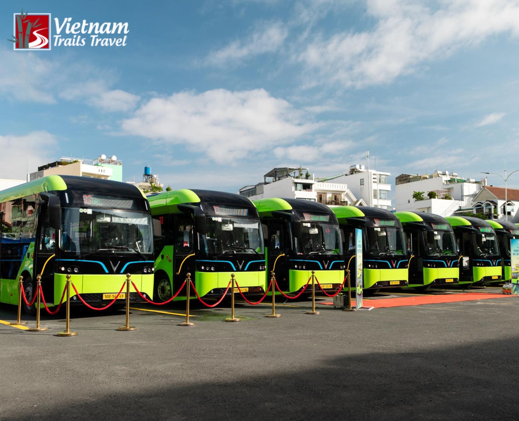 A fleet of VinBus electric public buses lined up at a terminal in Vietnam