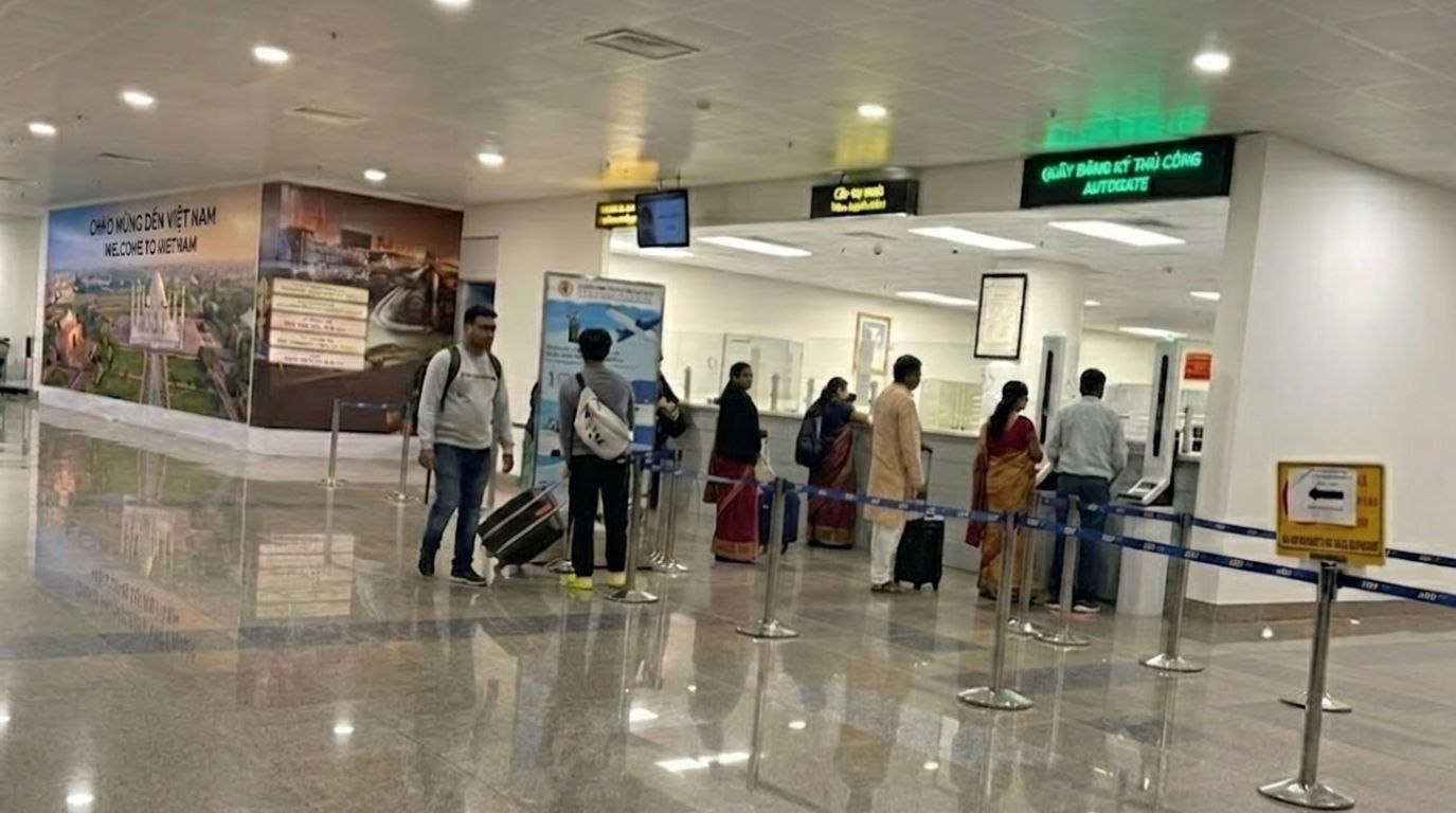 Indian citizens queuing at the airport immigration and visa processing counter for entry procedures