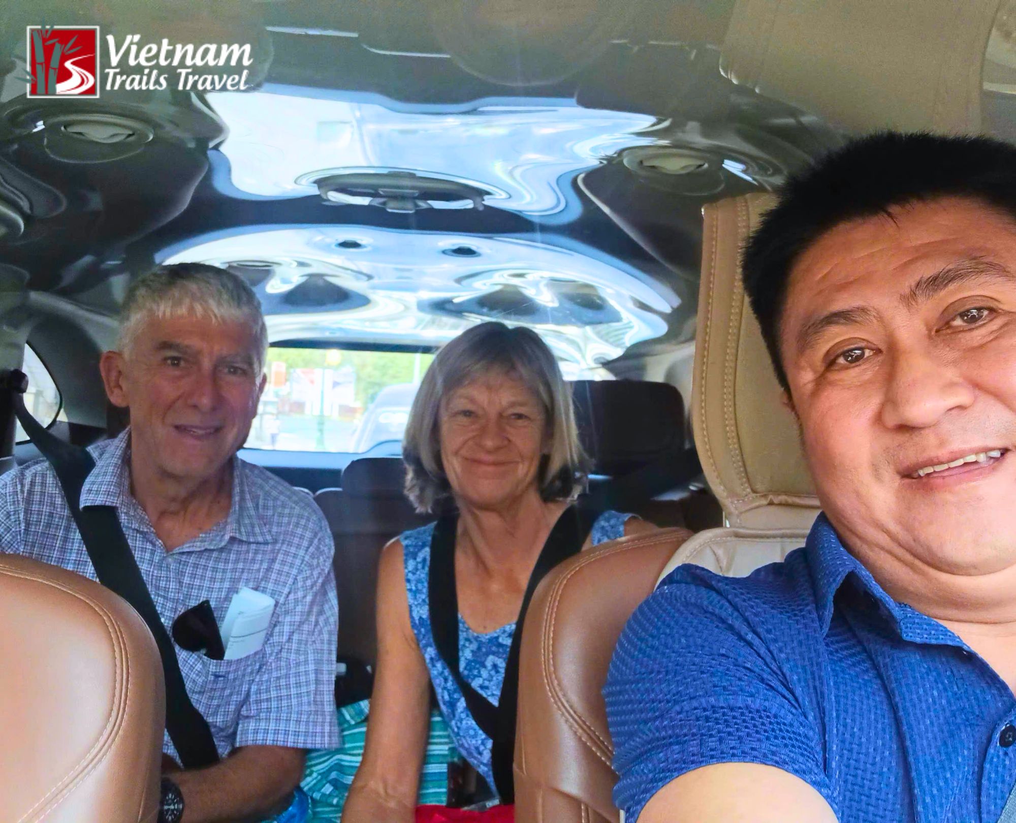 The driver took photos with the tourists after picking them up at the hotel