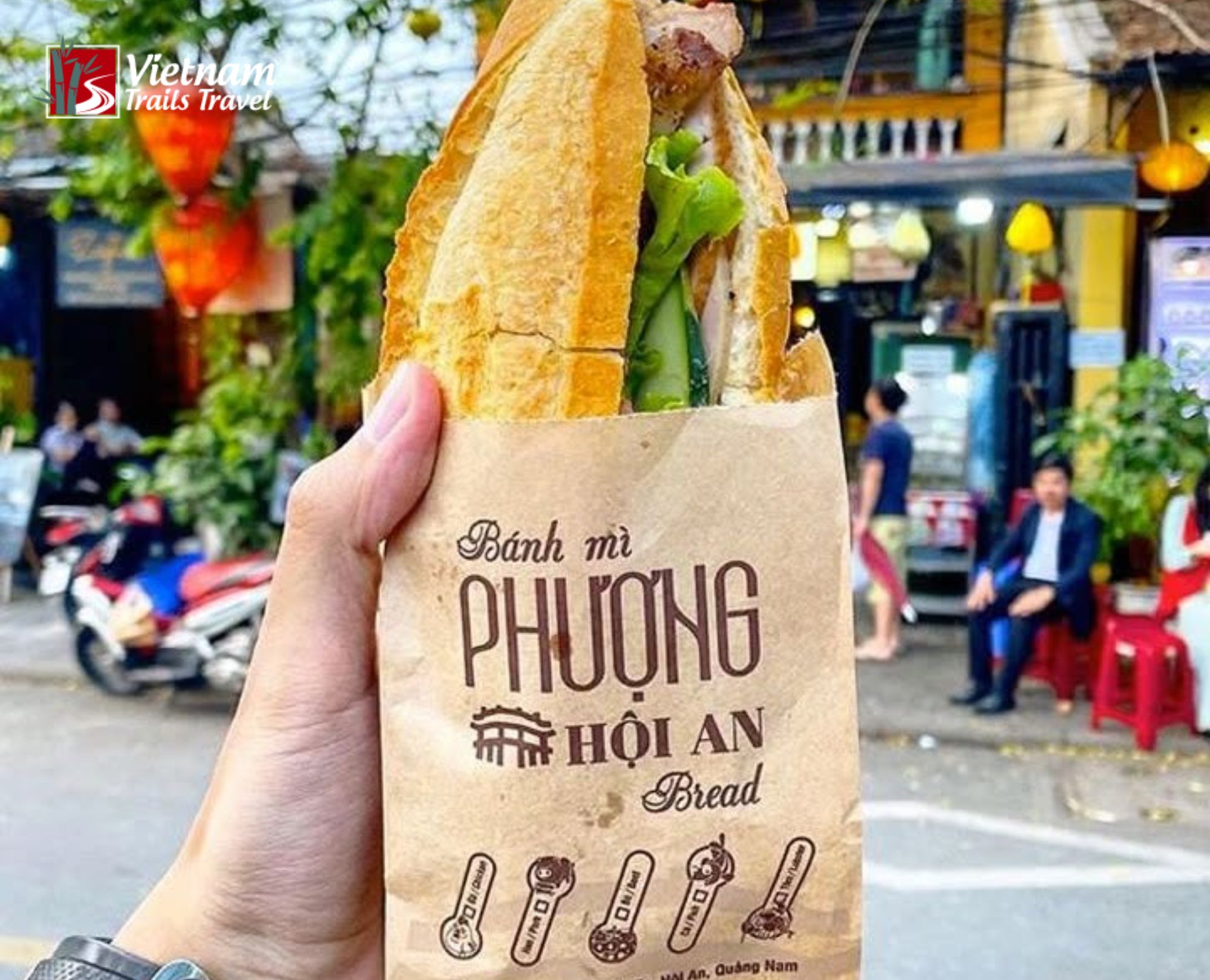 Biting into a Banh Mi while wandering the lantern lit streets of Hoi An is an essential food experience you cannot miss