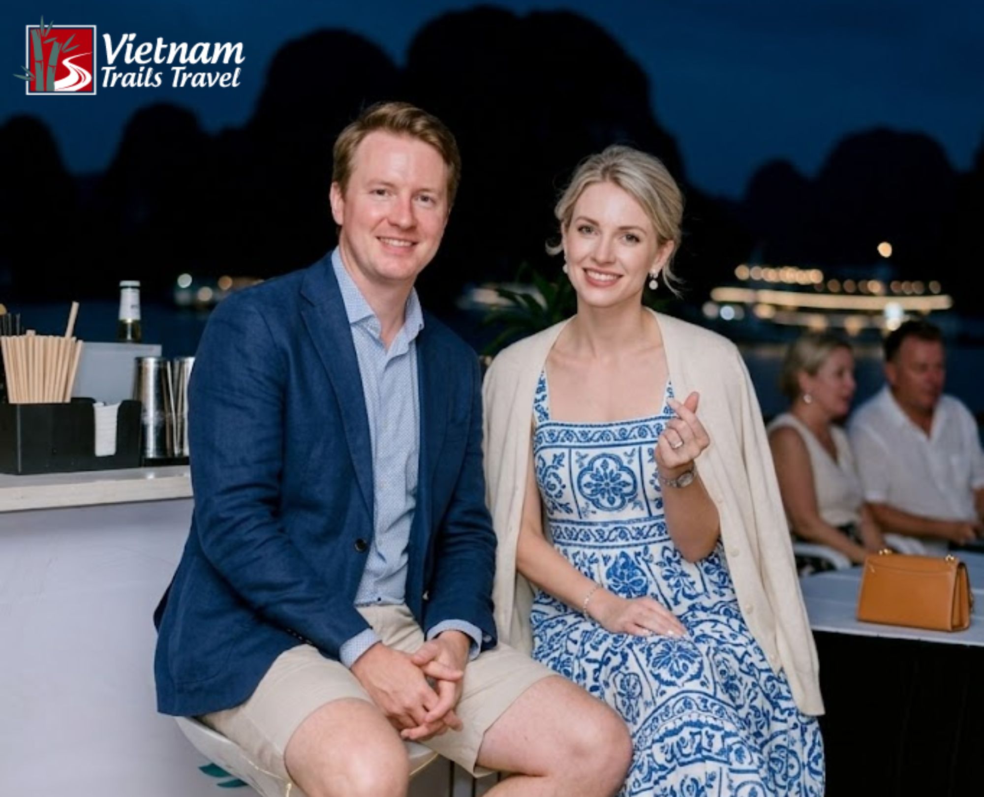 Couple enjoying evening cocktail at outdoor bar
