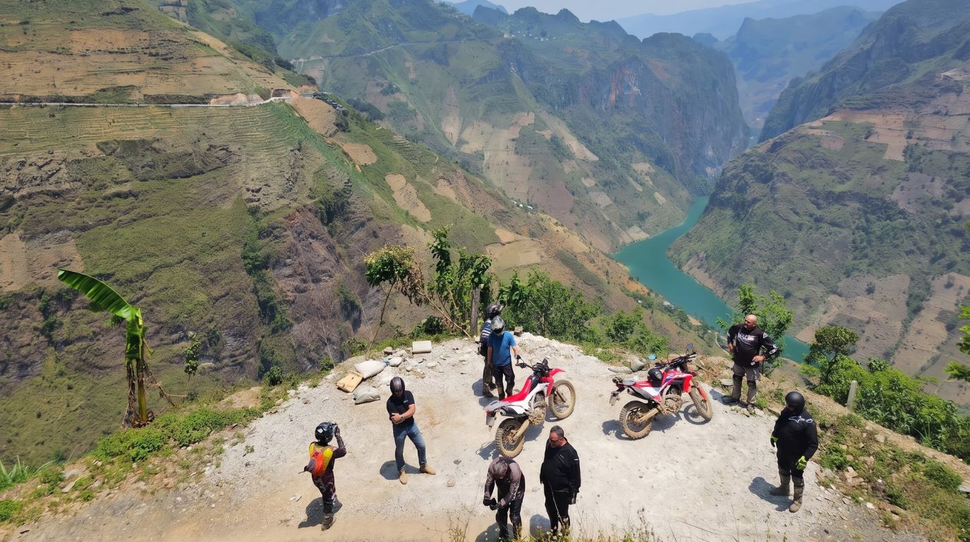 Extreme motorbike tour adventure overlooking the deep Tu San Canyon and Nho Que River