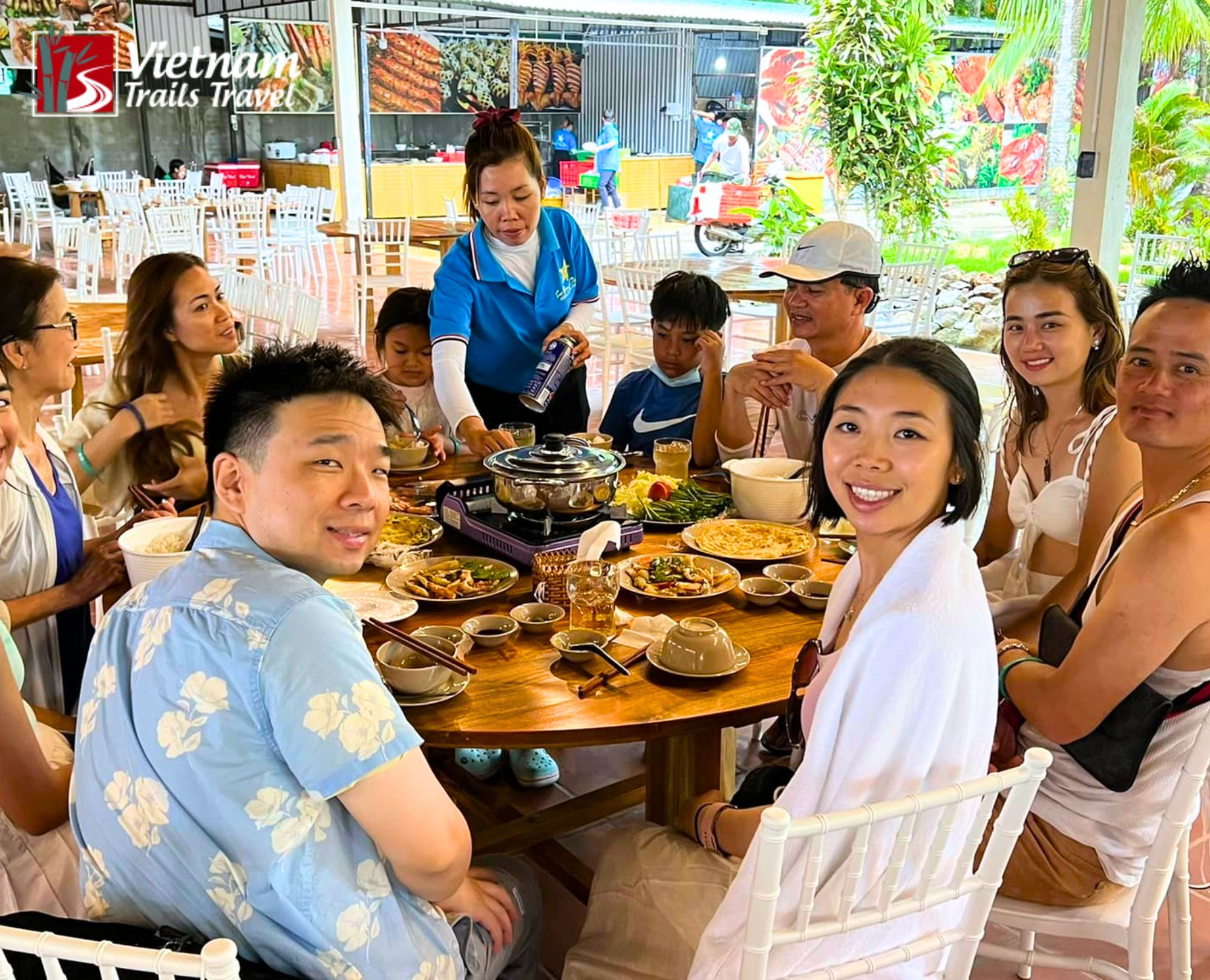 International tourists enjoying a fresh seafood lunch at a beachside restaurant on Sao Beach
