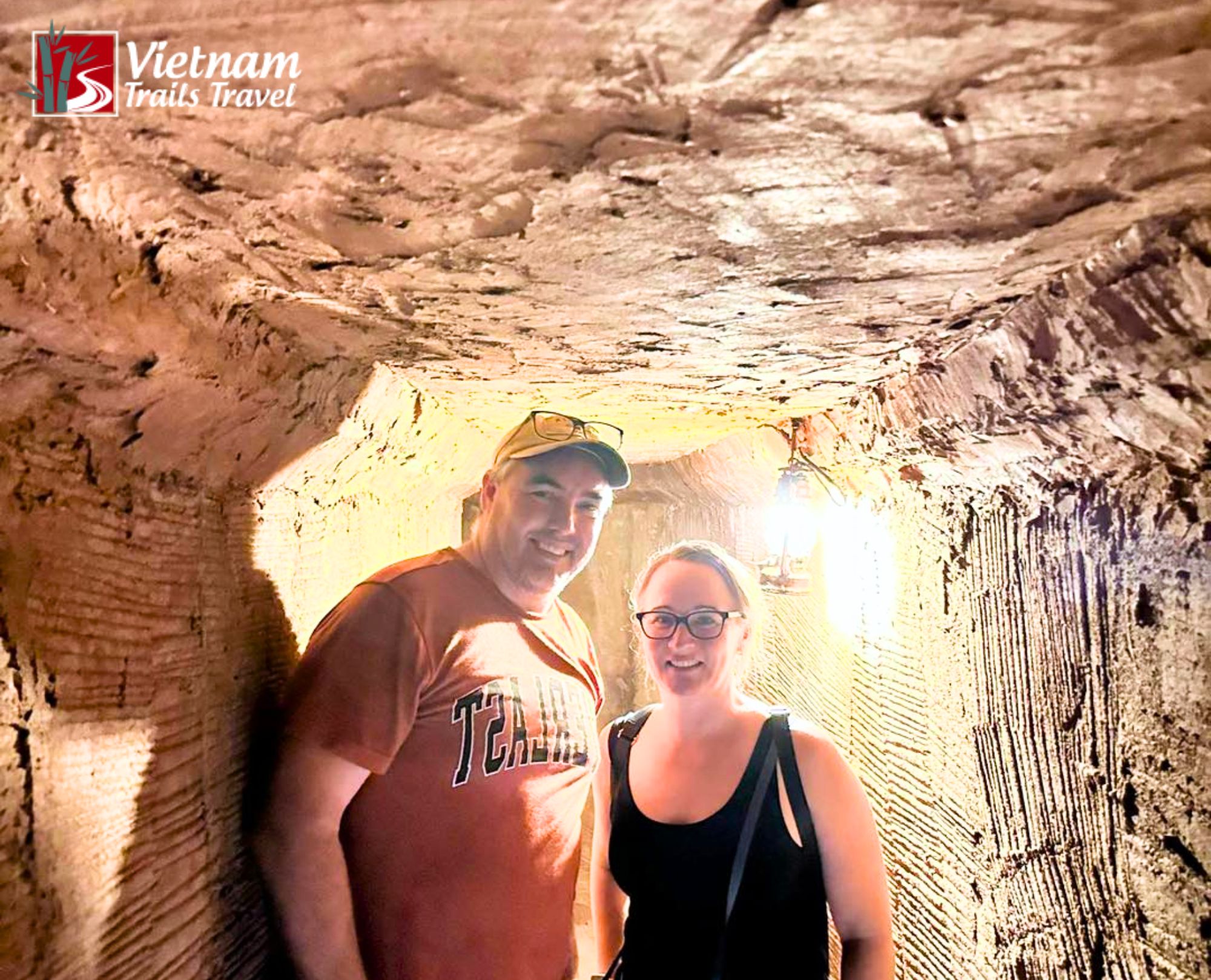 Tourists exploring the historic Long Phuoc Tunnels in Ba Ria - Vung Tau, experiencing the underground network used during the war
