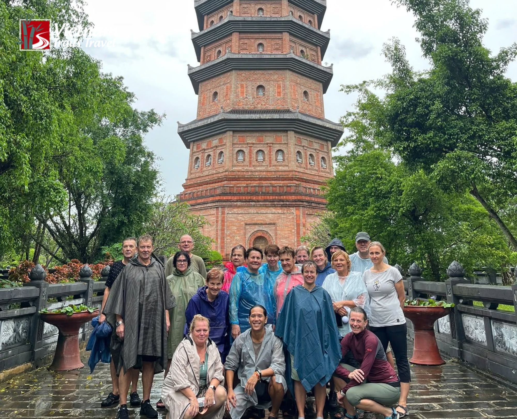 Tourists visiting Bai Dinh Pagoda on a rainy day in Ninh Binh