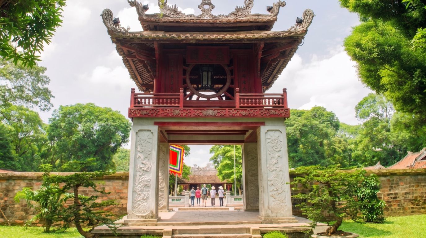 Tourists visiting the iconic Khue Van Cac red pavilion at the historic Temple of Literature in Hanoi