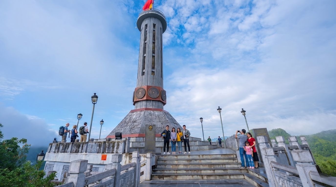 Tourists visiting the iconic Lung Cu Flag Tower, marking the extreme northernmost point of Vietnam in Ha Giang