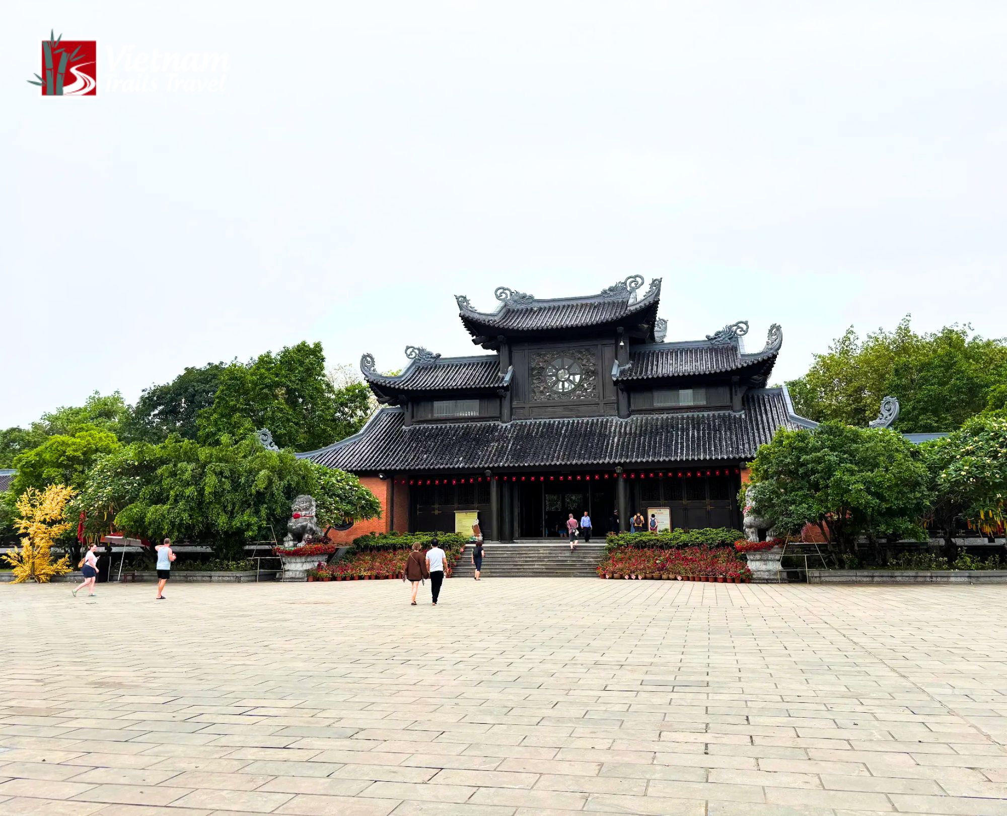 Tourists walking through Bai Dinh Pagoda plaza Vietnam