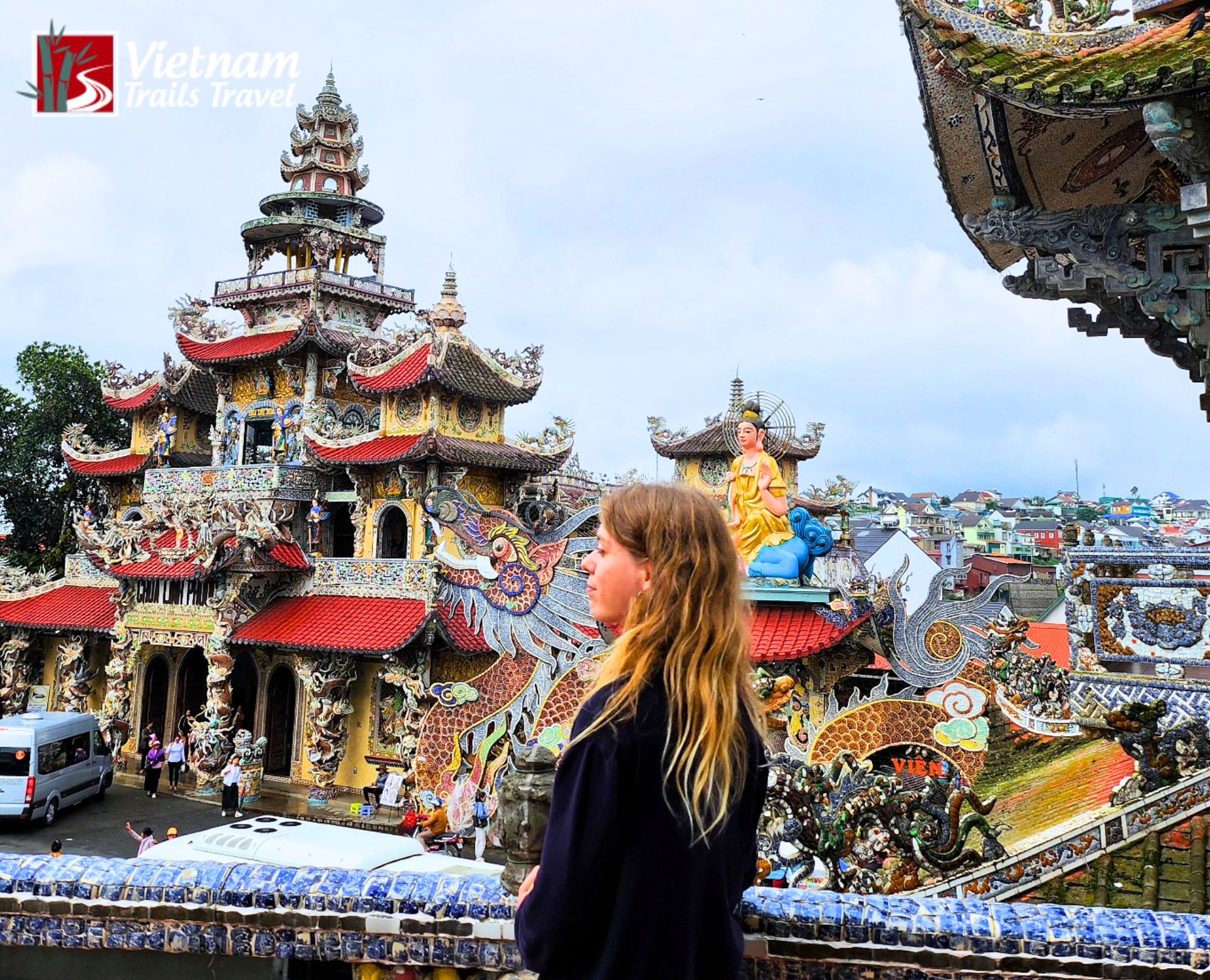 Western tourist visiting the historic and colorful Linh Phuoc Pagoda