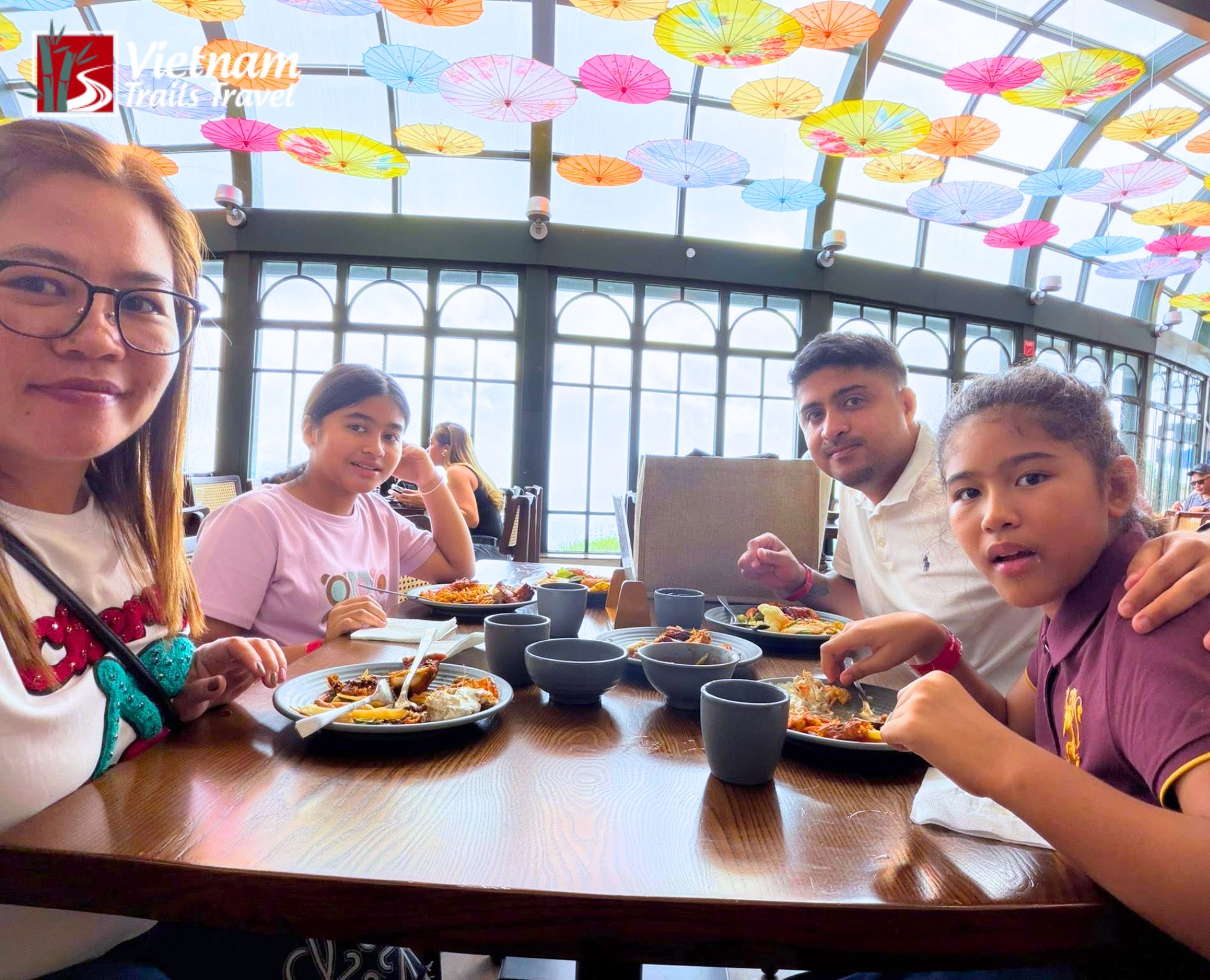 Family enjoying buffet lunch at a restaurant in Ba Na Hills