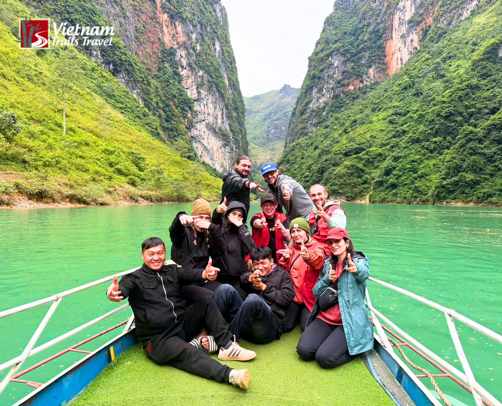 Tour guide and driver taking photos with travelers on the 3-day-3-night all-inclusive tour in Hà Giang