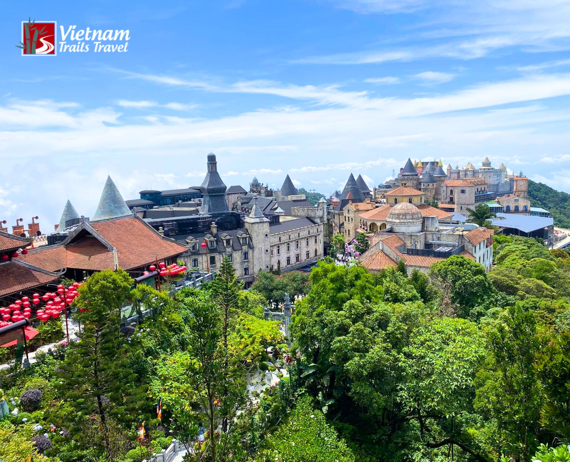 Bird eye view of French Village at Ba Na Hills nestled on green hillside under blue sky