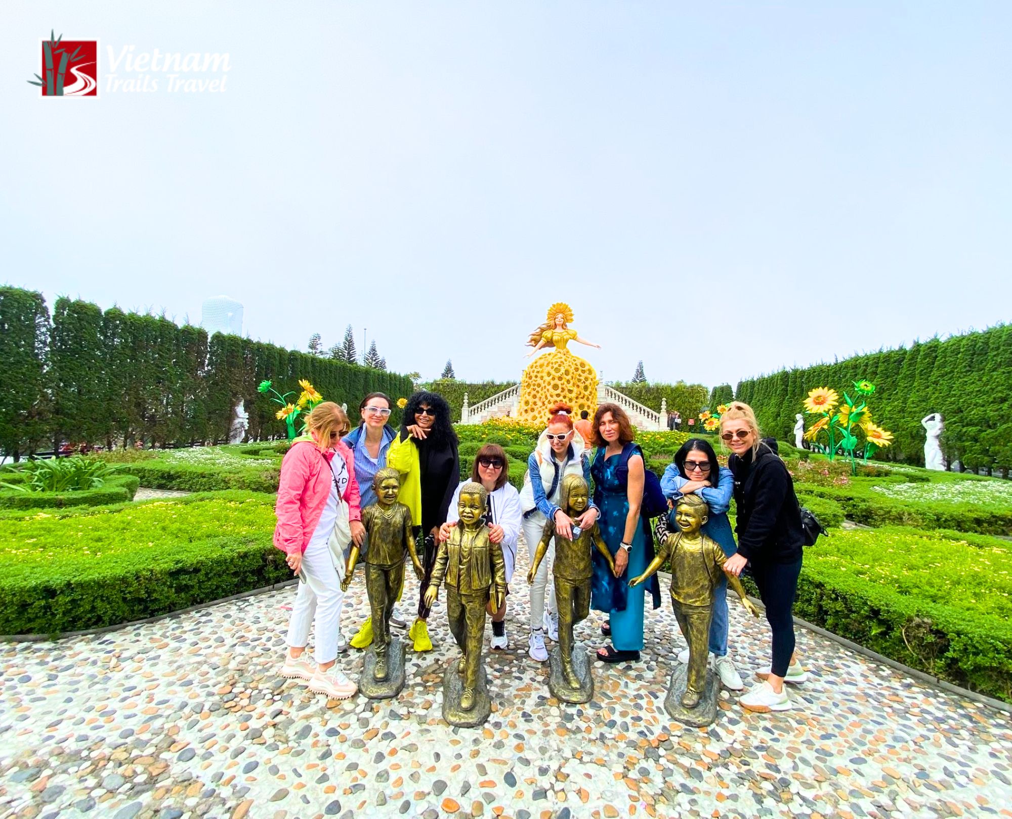 Exploring Le Jardin D'Amour Flower Garden on Ba Na Hills private tour with garden pathway