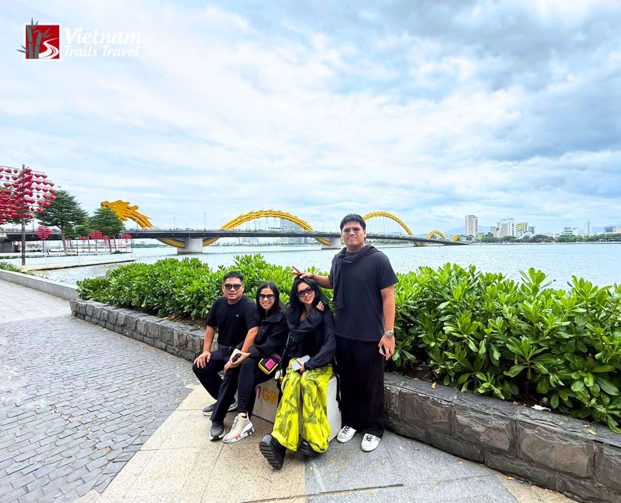 Guests posing with the famous Dragon Bridge behind them
