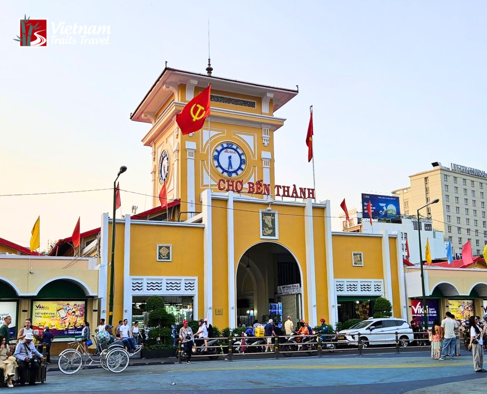 Ben Thanh Market building bustling with activity, perfect for planning a central Saigon travel route