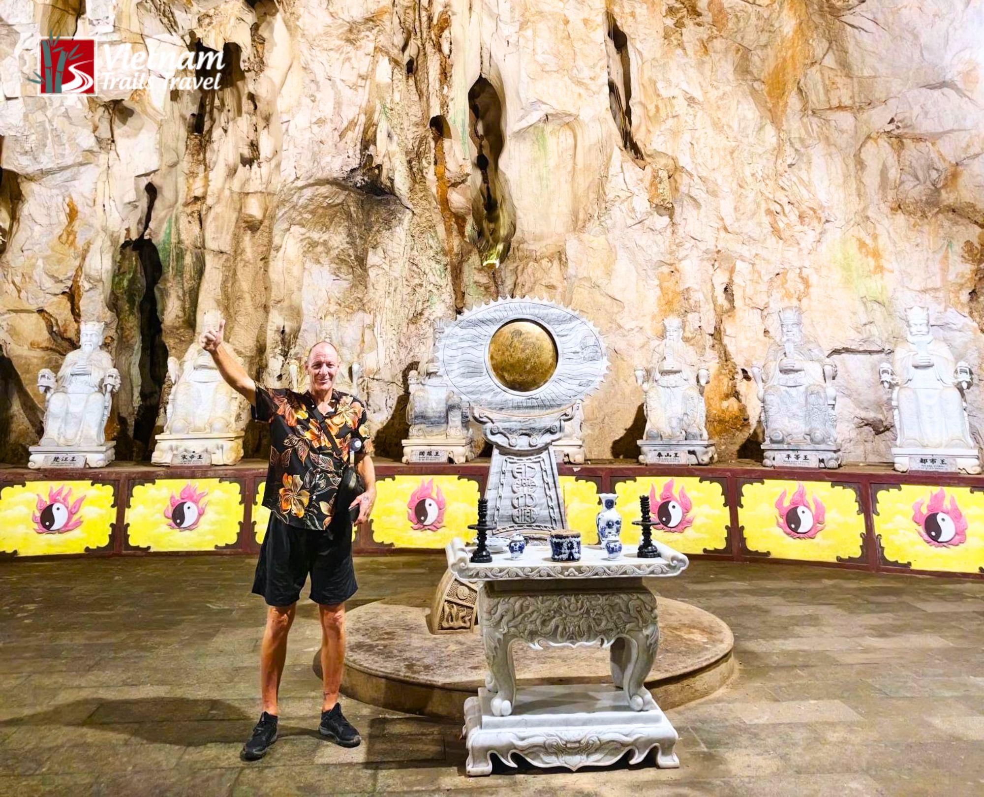 Cavern interior view featuring spiritual underworld displays and rock formations in Am Phu Cave