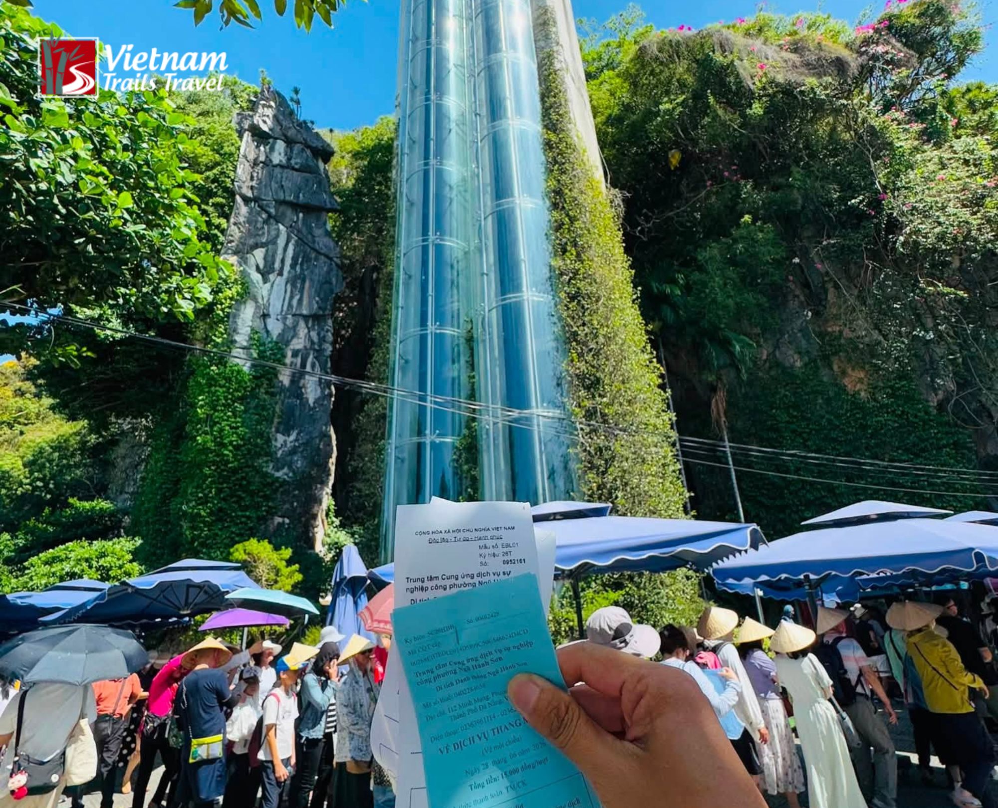 Scenic view of the outdoor glass elevator at Ngu Hanh Son, helping visitors choose between elevator and stairs