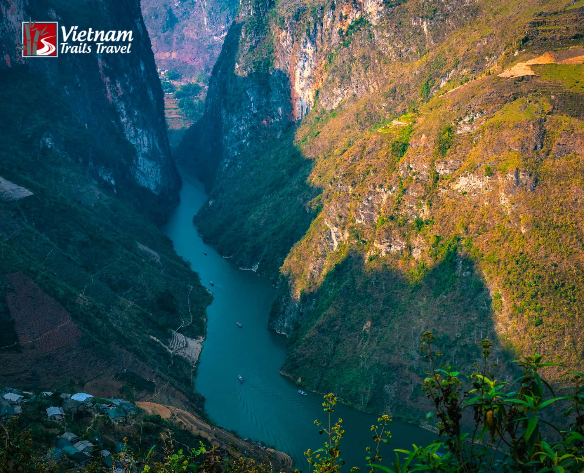 Amazing natural wonder of towering mountains and emerald water at Tu San Canyon