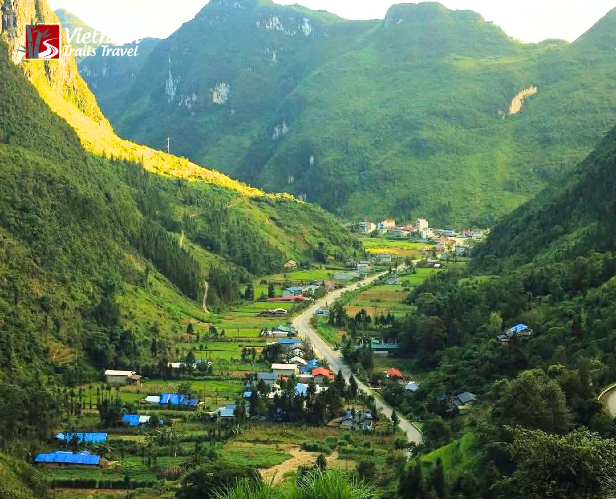 Green season from May to September aerial view of Sung La Valley with vivid green fields and a winding road