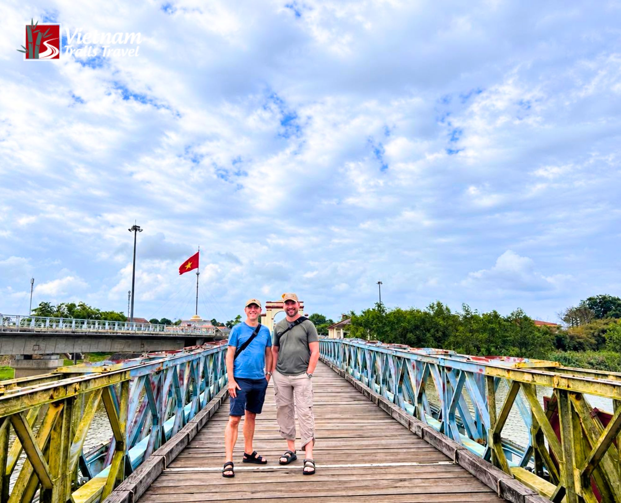 Iconic two tone Hien Luong Bridge on the 17th parallel visited by foreign tourists during a private historical day trip