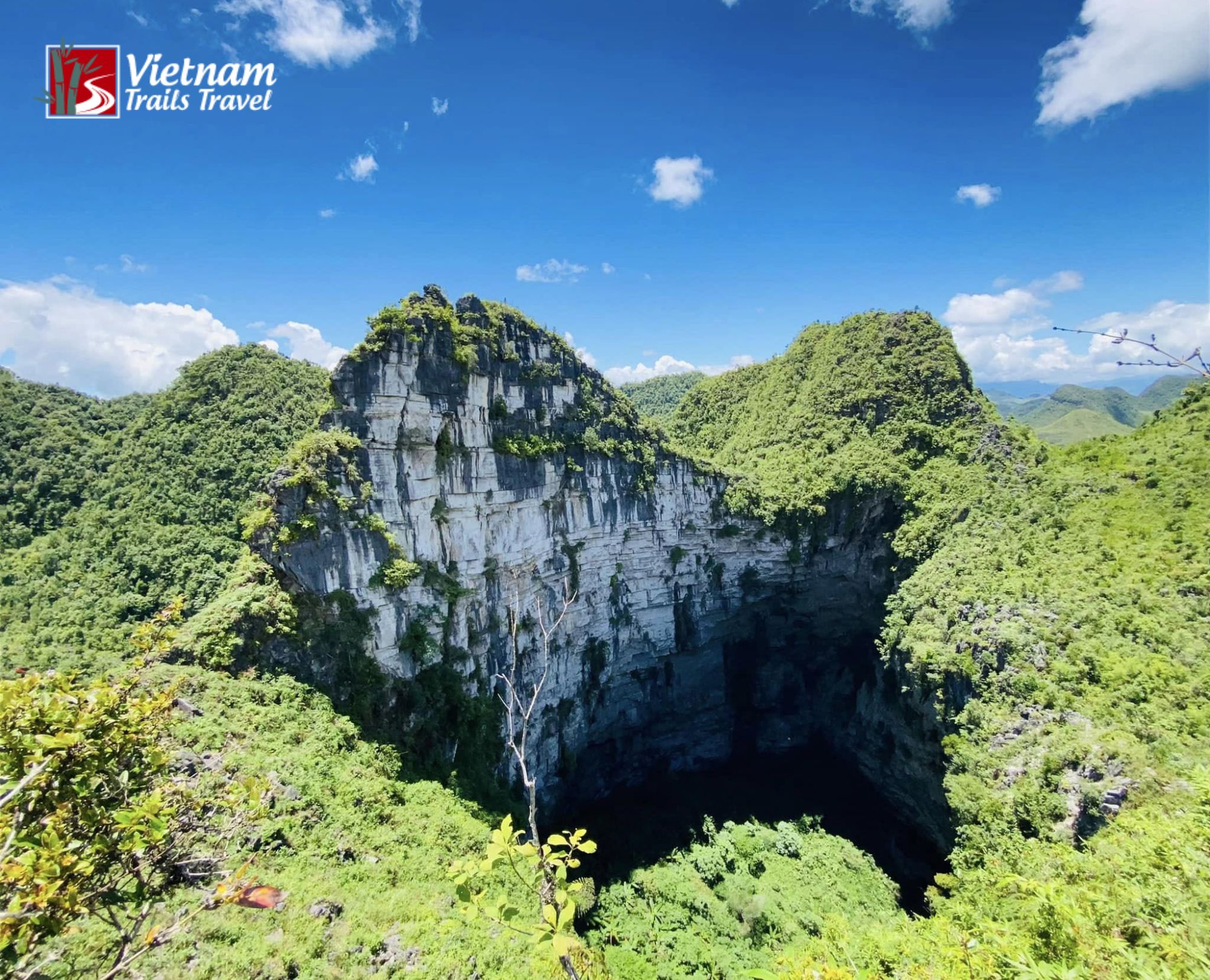 Meo Vac Sinkhole location with limestone cliffs and dense greenery