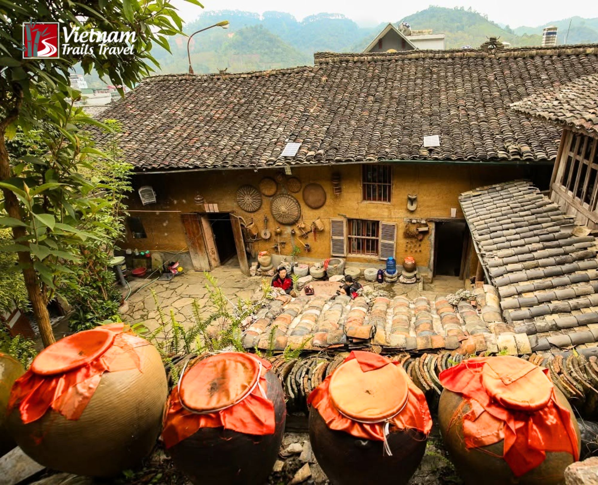 Peaceful village view of a historic home with ancient tile roofs in Dong Van