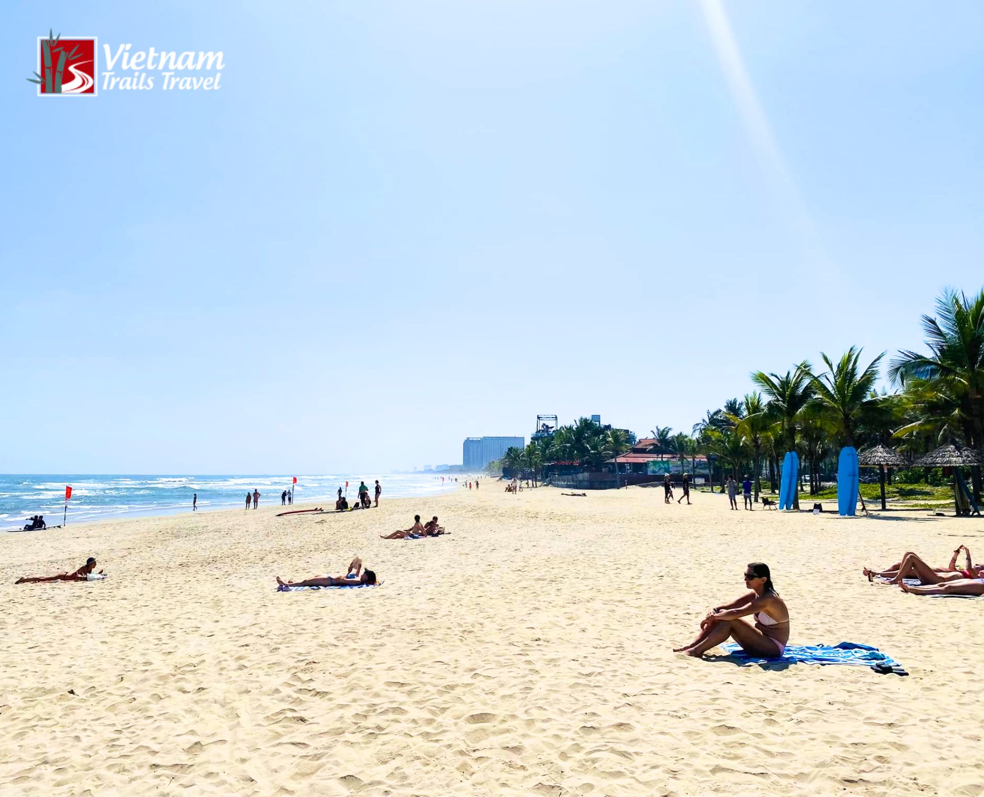 Scenic tropical seaside view of travelers at popular My Khe Beach