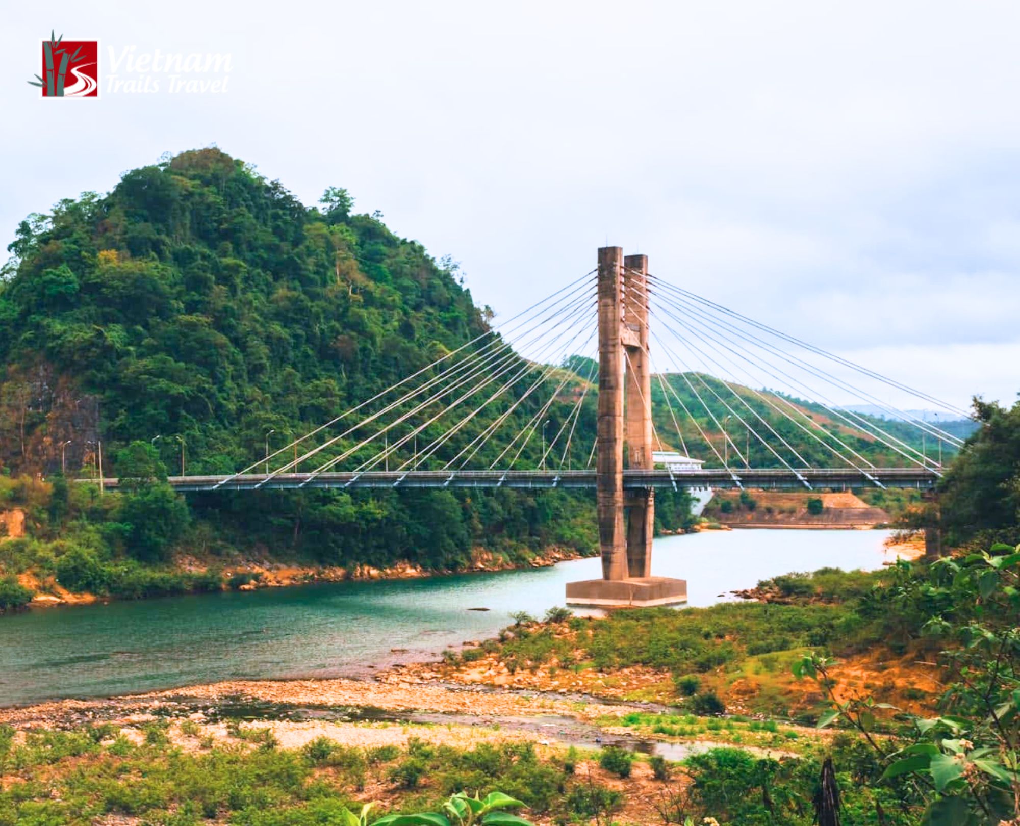 Scenic view of Dakrong Bridge cable stayed structure surrounded by green mountains in Quang Tri Vietnam