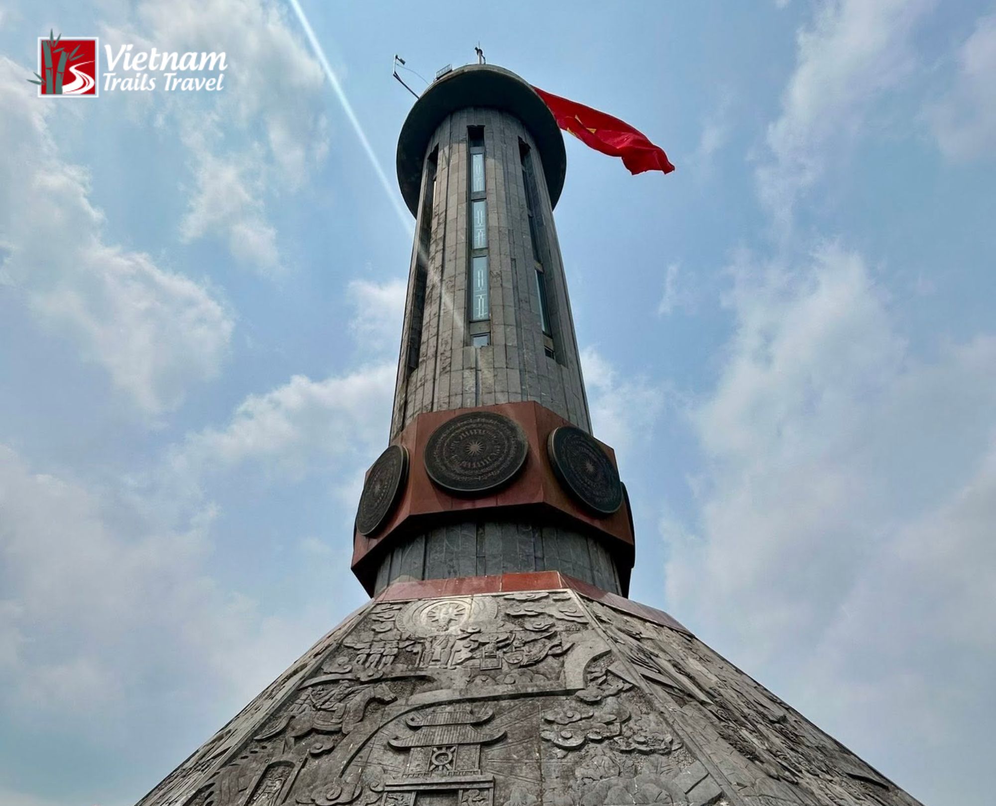 The Lung Cu Flag Pole stands tall at the northern edge of Vietnam beneath drifting clouds
